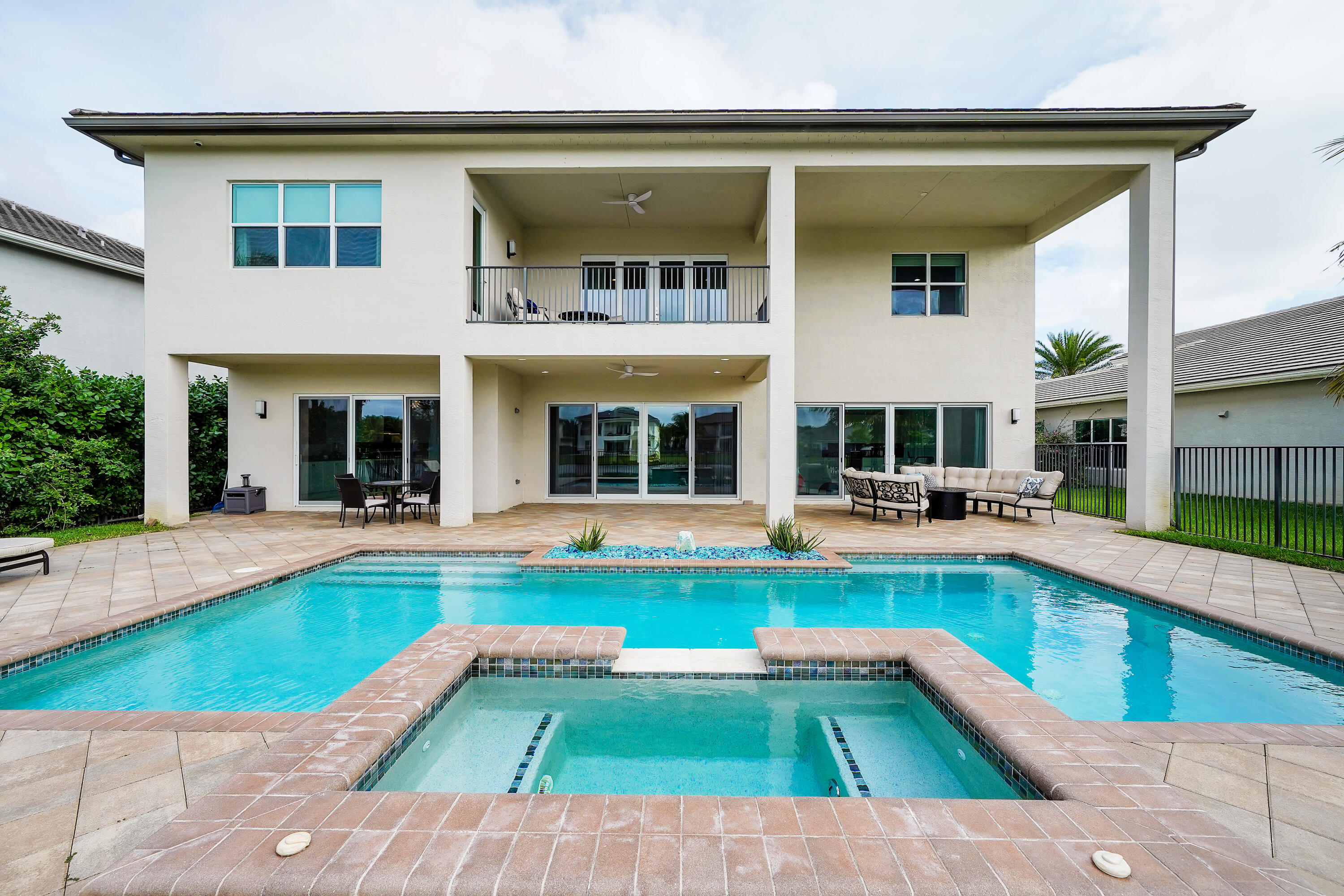 19871 Meadowside Lane Boca Raton, FL 33498 - Photo 8 of 102 a view of a house with swimming pool having outdoor seating