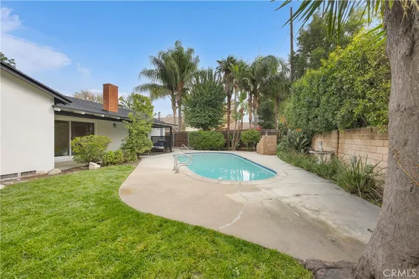 a view of a patio with a yard