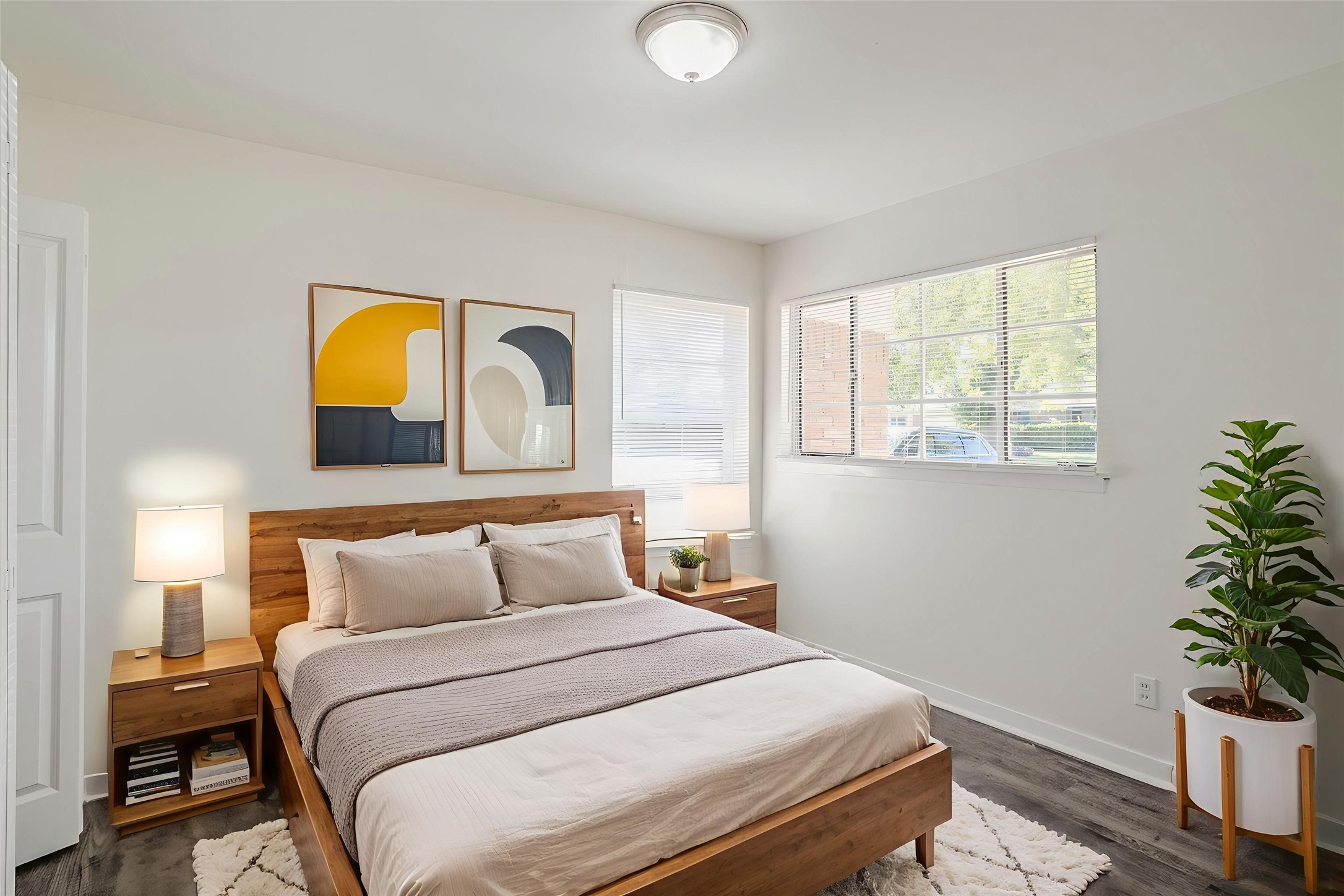 6434 Leader Street Houston, TX 77074 - Photo 11 of 46 a bedroom with a bed and potted plant