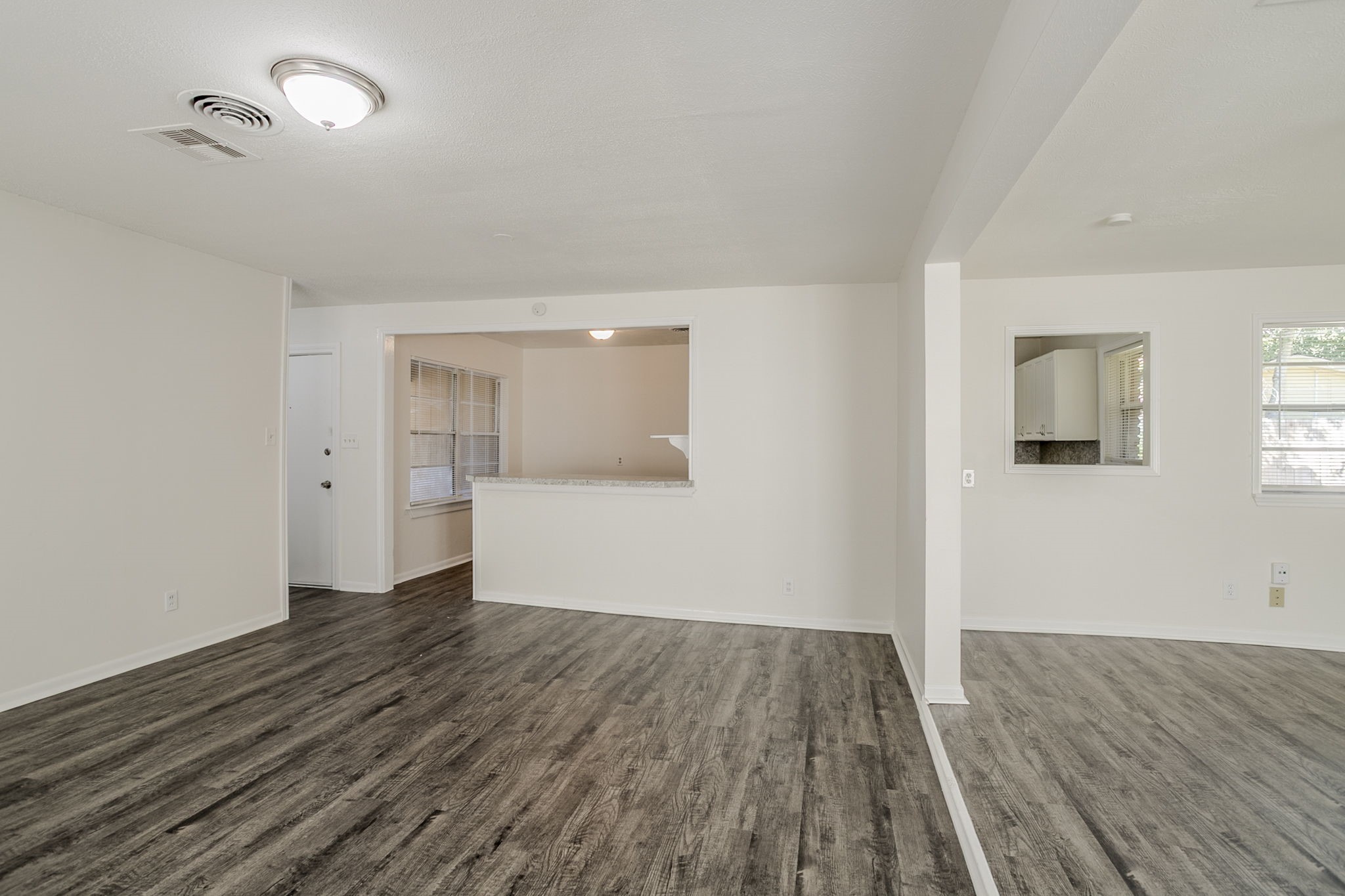 6434 Leader Street Houston, TX 77074 - Photo 15 of 46 wooden floor in an empty room with a window