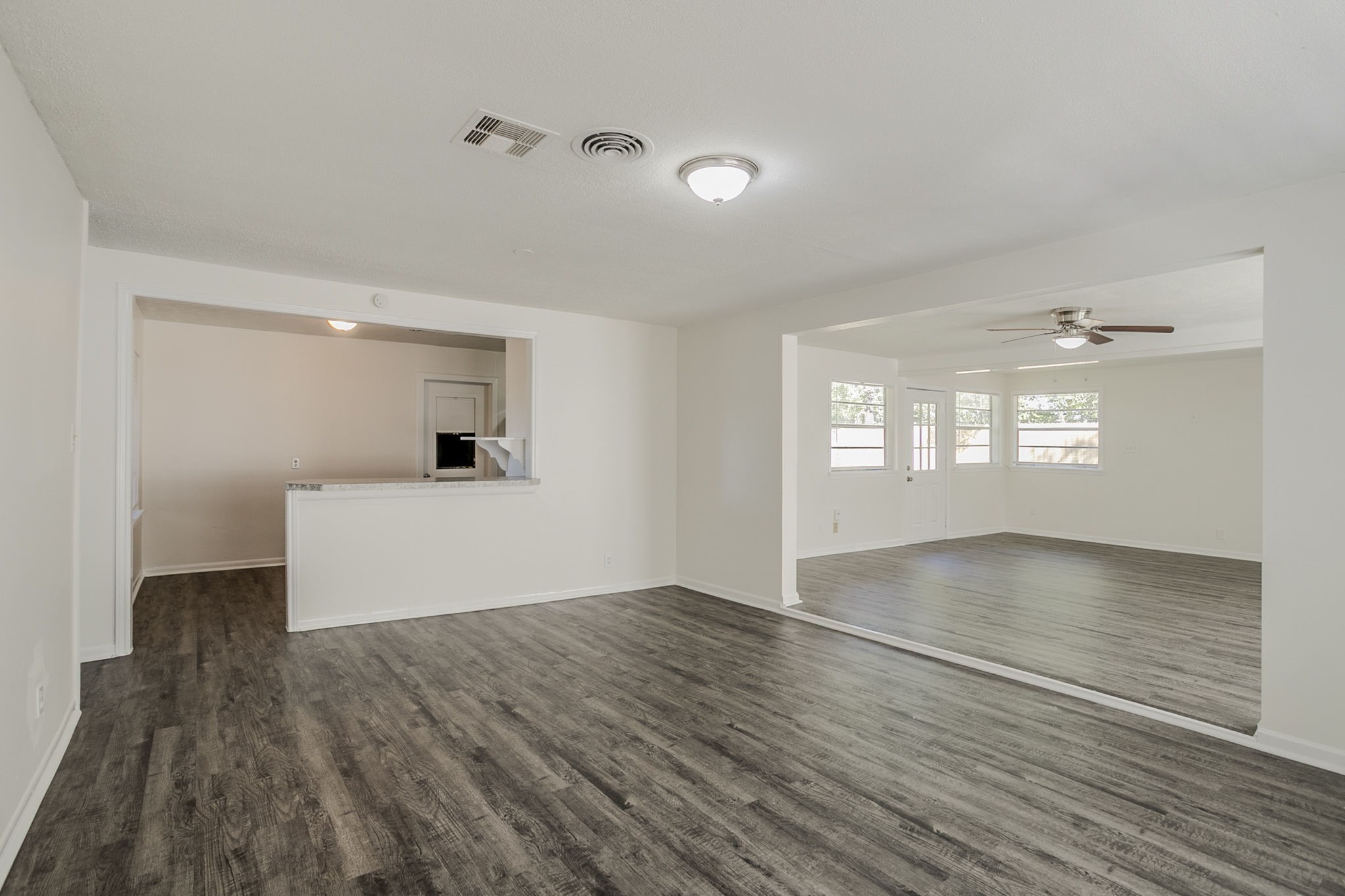 6434 Leader Street Houston, TX 77074 - Photo 17 of 46 a view of empty room with wooden floor and fan