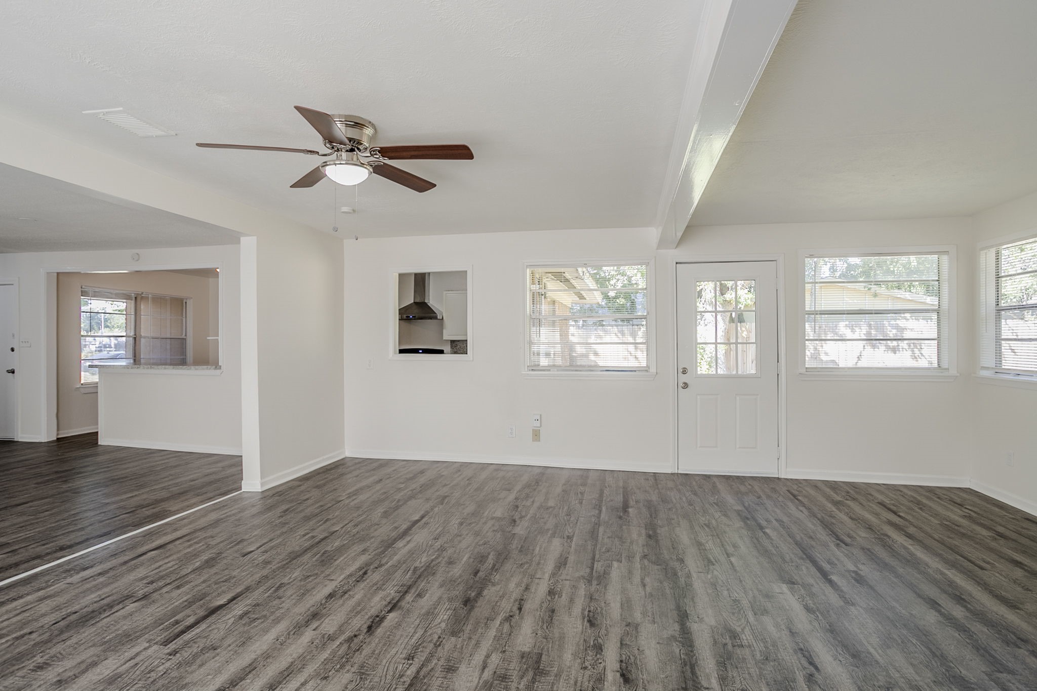 6434 Leader Street Houston, TX 77074 - Photo 22 of 46 a view of empty room with wooden floor and fan