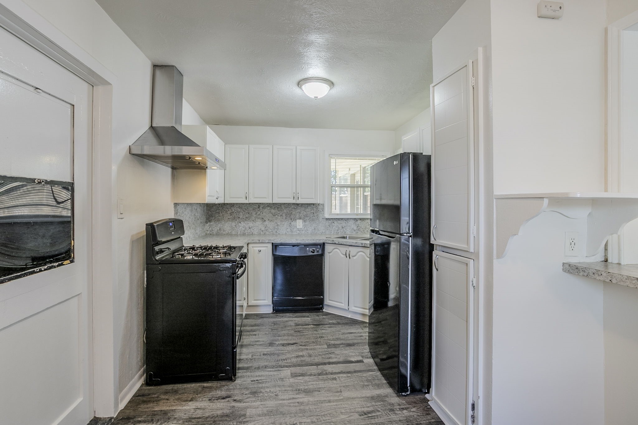 6434 Leader Street Houston, TX 77074 - Photo 26 of 46 a kitchen with stainless steel appliances granite countertop a refrigerator stove and sink