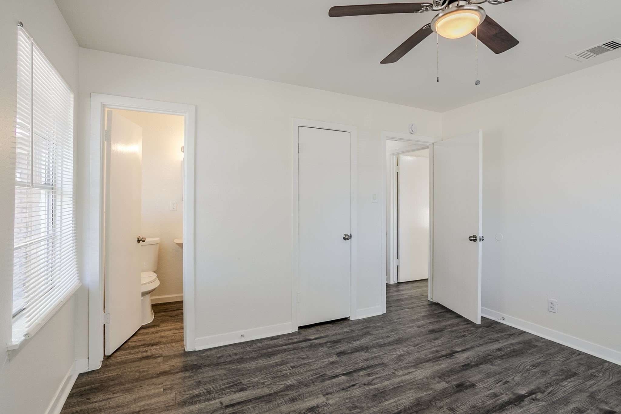 6434 Leader Street Houston, TX 77074 - Photo 30 of 46 a view of an empty room with wooden floor and a window