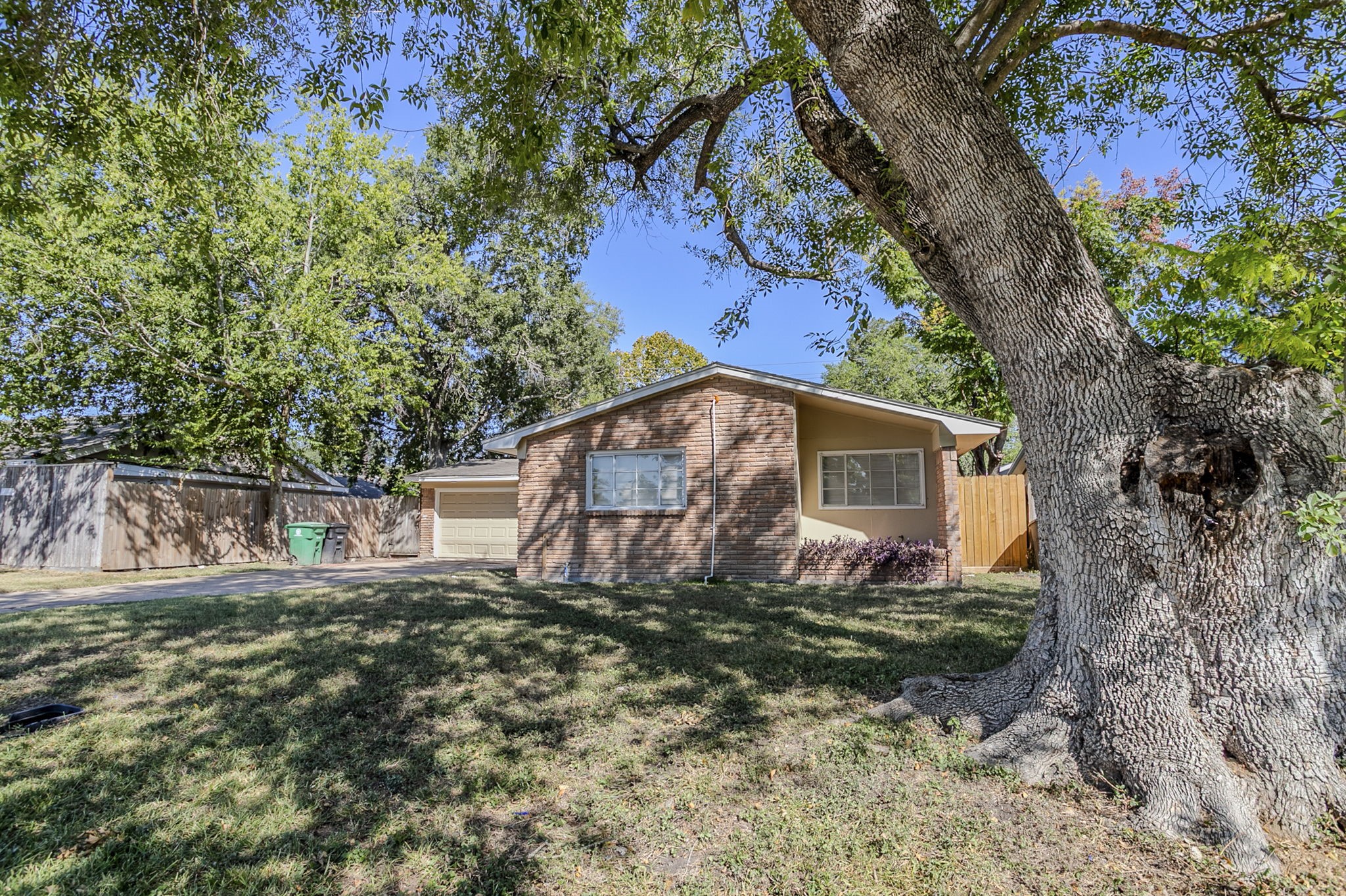 6434 Leader Street Houston, TX 77074 - Photo 3 of 46 a view of a house with a yard
