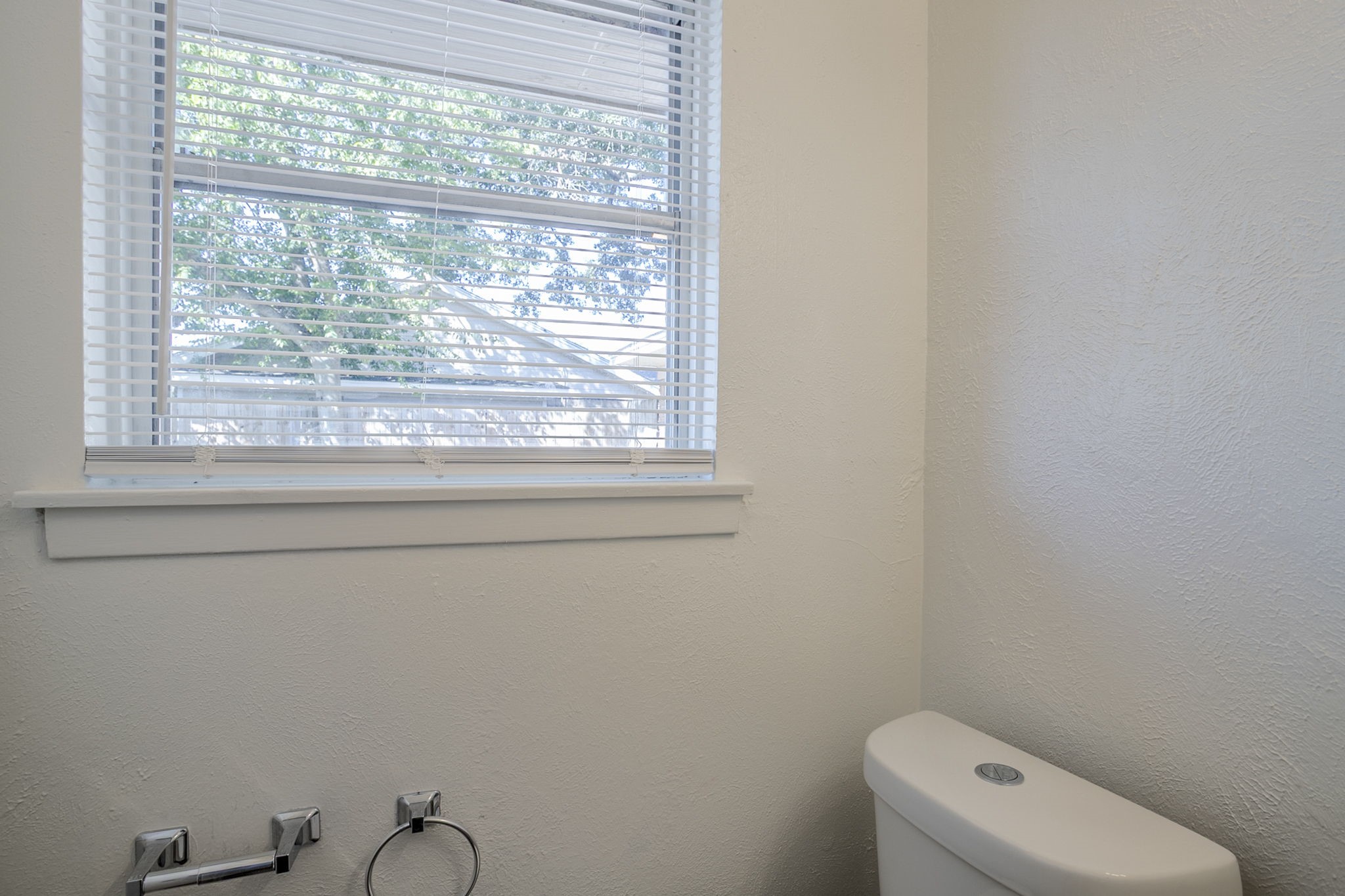 6434 Leader Street Houston, TX 77074 - Photo 34 of 46 a bathroom with a toilet a sink and a window