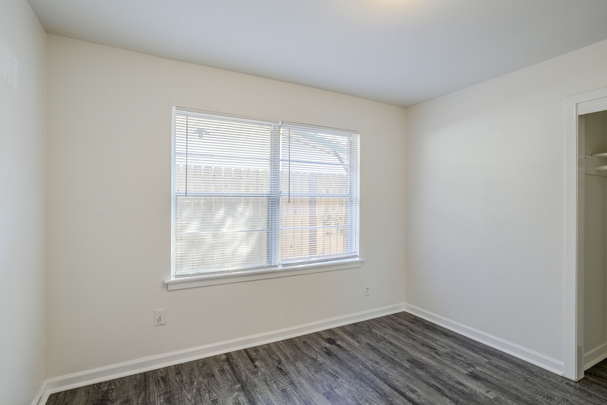 6434 Leader Street Houston, TX 77074 - Photo 38 of 46 a view of an empty room with wooden floor and a window