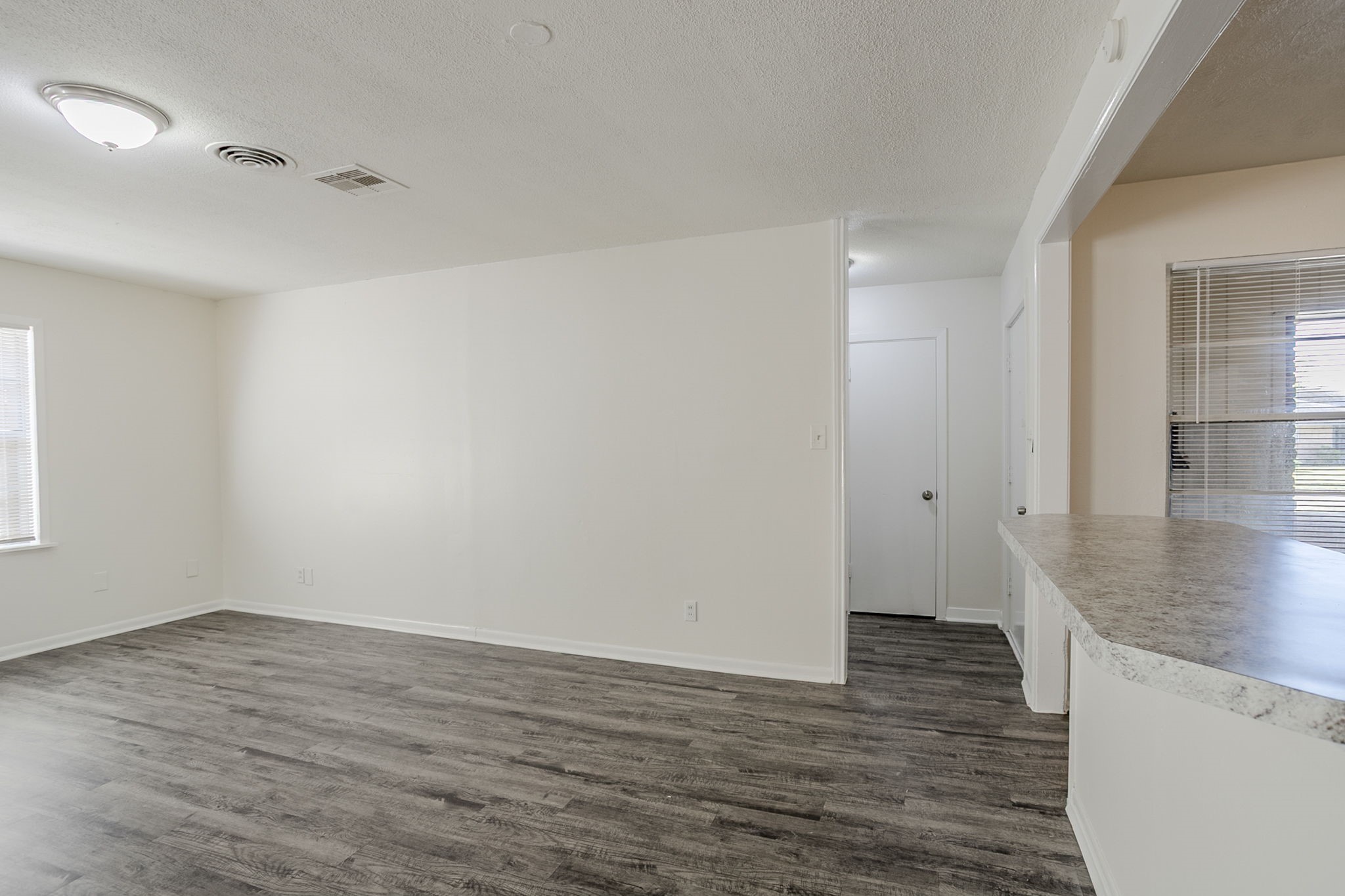 6434 Leader Street Houston, TX 77074 - Photo 6 of 46 a view of a room with wooden floor and bench