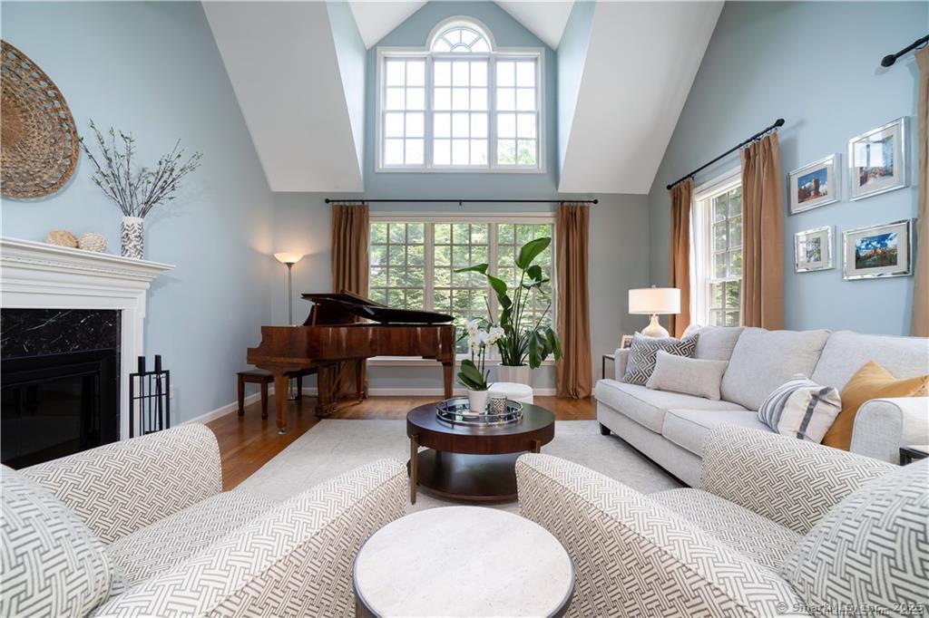 33 Old Field Hill Road, Unit 12 Southbury, CT 06488 - Photo 1 of 1 a living room with furniture and a large window