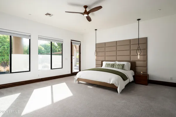 a bedroom with a bed and a television