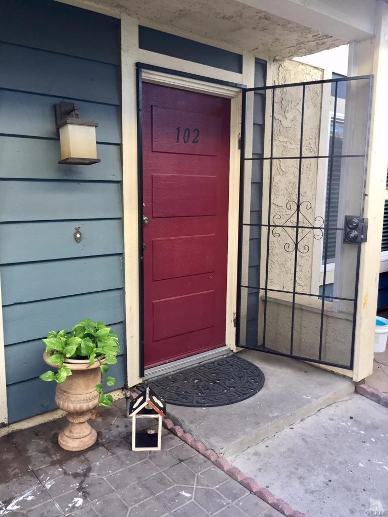 532 Spring Road, Unit 102 Moorpark, CA 93021 - Photo 1 of 10 a view of a balcony with chair and potted plants