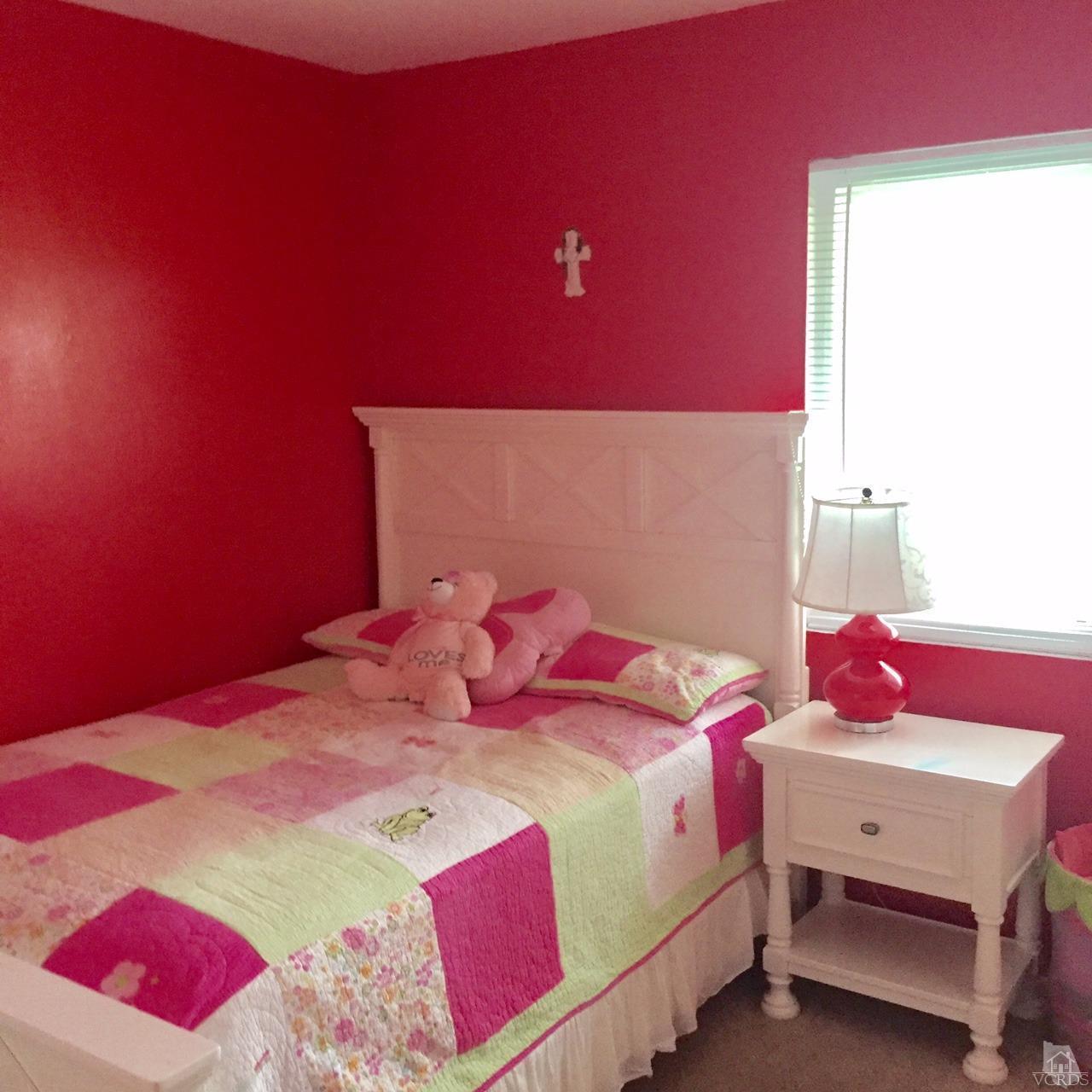 532 Spring Road, Unit 102 Moorpark, CA 93021 - Photo 8 of 10 a bedroom with a bed and a window