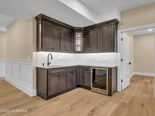 a kitchen with granite countertop a sink and a stove