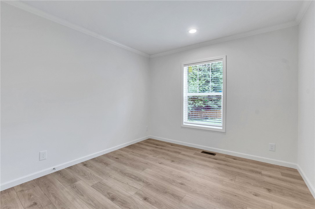 108 Old River Road Iva, SC 29655 - Photo 20 of 31 Bright, neutral-toned room with durable plank flooring, ready for personalization.