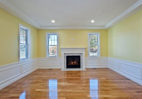49 Tarbox Street Dedham, MA 02026 - Photo 15 of 30 a view of an empty room with window and fire place