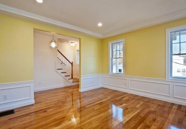 49 Tarbox Street Dedham, MA 02026 - Photo 16 of 30 a view of an entryway with wooden floor and cabinet