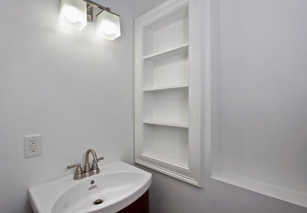 49 Tarbox Street Dedham, MA 02026 - Photo 18 of 30 a bathroom with a sink and mirror