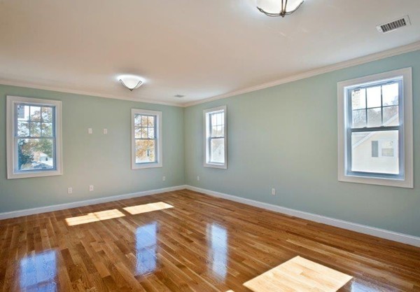 49 Tarbox Street Dedham, MA 02026 - Photo 19 of 30 a view of empty room with wooden floor and fan