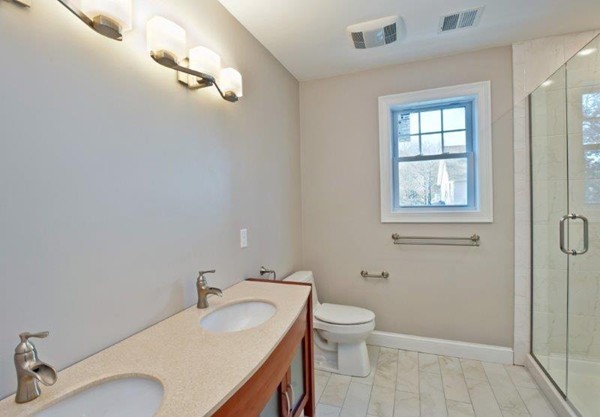 49 Tarbox Street Dedham, MA 02026 - Photo 20 of 30 a bathroom with a sink toilet and shower
