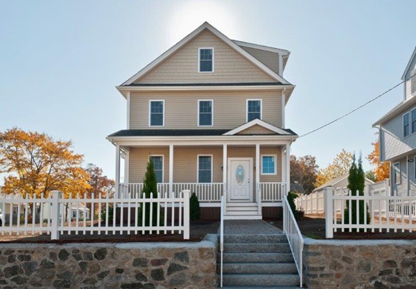 49 Tarbox Street Dedham, MA 02026 - Photo 2 of 30 a front view of a house with garden