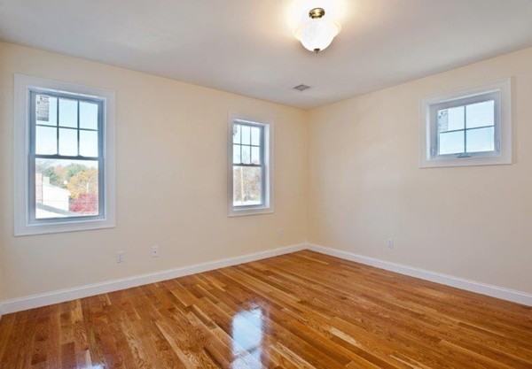 49 Tarbox Street Dedham, MA 02026 - Photo 22 of 30 a view of a room with wooden floor and windows