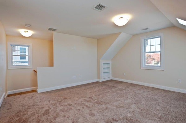 49 Tarbox Street Dedham, MA 02026 - Photo 27 of 30 an empty room with windows and closet