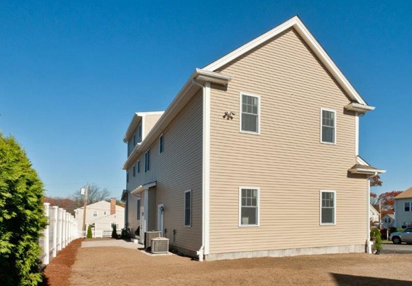 49 Tarbox Street Dedham, MA 02026 - Photo 5 of 30 a view of a house with a patio