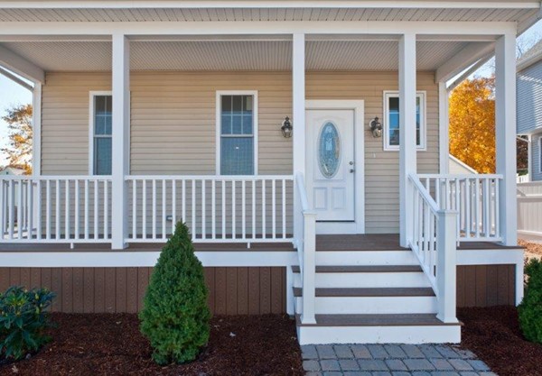 49 Tarbox Street Dedham, MA 02026 - Photo 7 of 30 a front view of a house with a garden