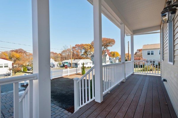 49 Tarbox Street Dedham, MA 02026 - Photo 8 of 30 a view of a balcony with wooden floor