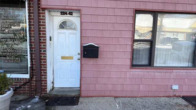 a front view of a house with a brick wall