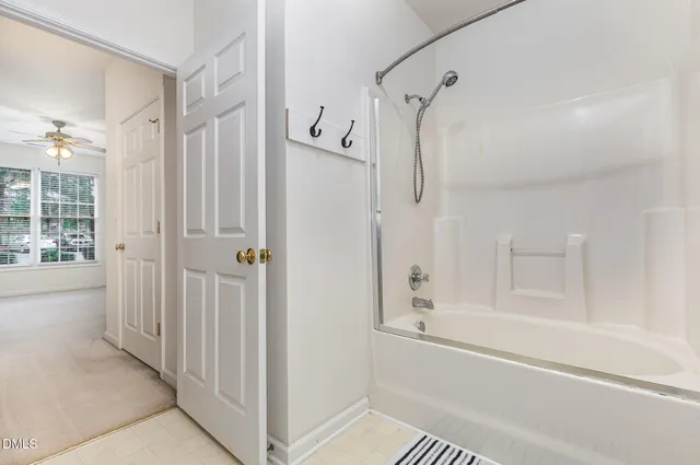 a bathroom with double sink and a mirror