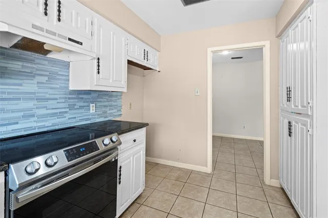 a view of a kitchen with appliances