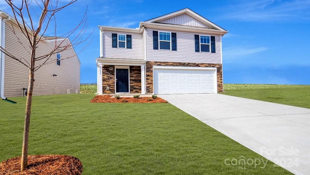 509 Jaca Lane Arden, NC 28704 - Photo 1 of 28 a front view of a house with garden