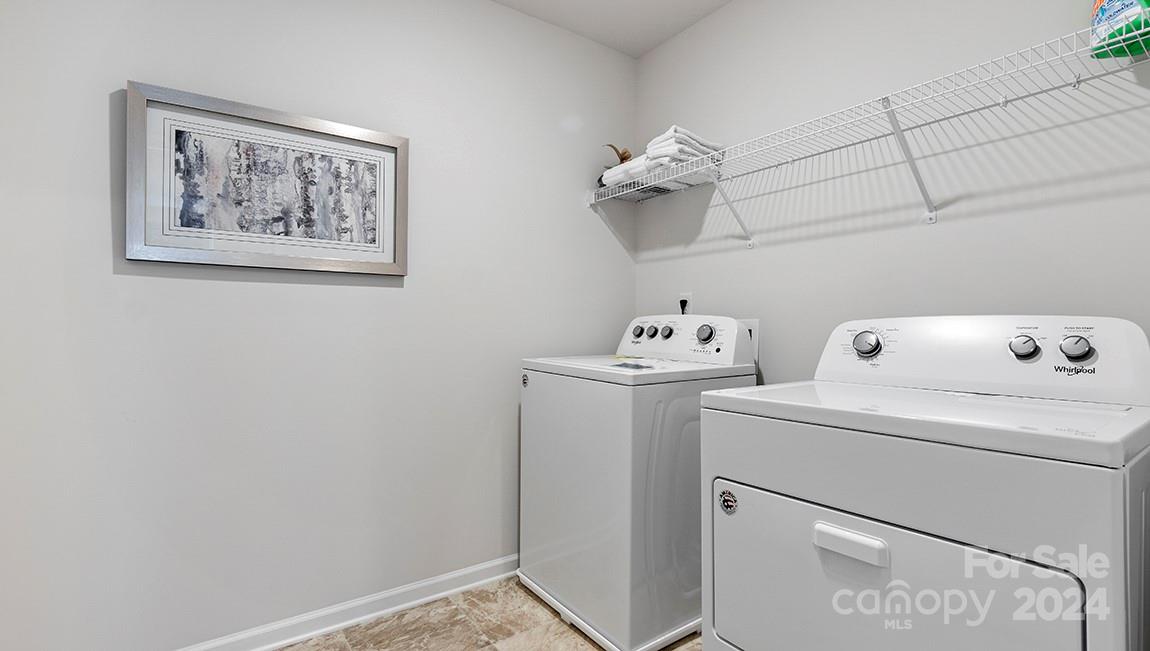 509 Jaca Lane Arden, NC 28704 - Photo 23 of 28 a view of storage and utility room with washer and dryer