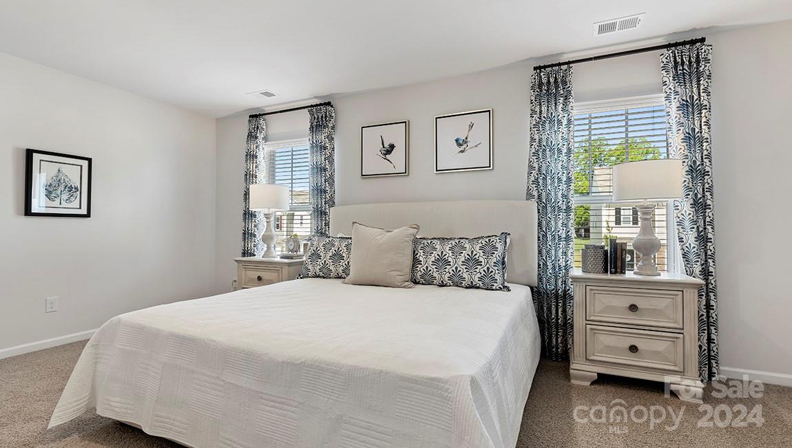 509 Jaca Lane Arden, NC 28704 - Photo 24 of 28 a bedroom with a large bed and a window