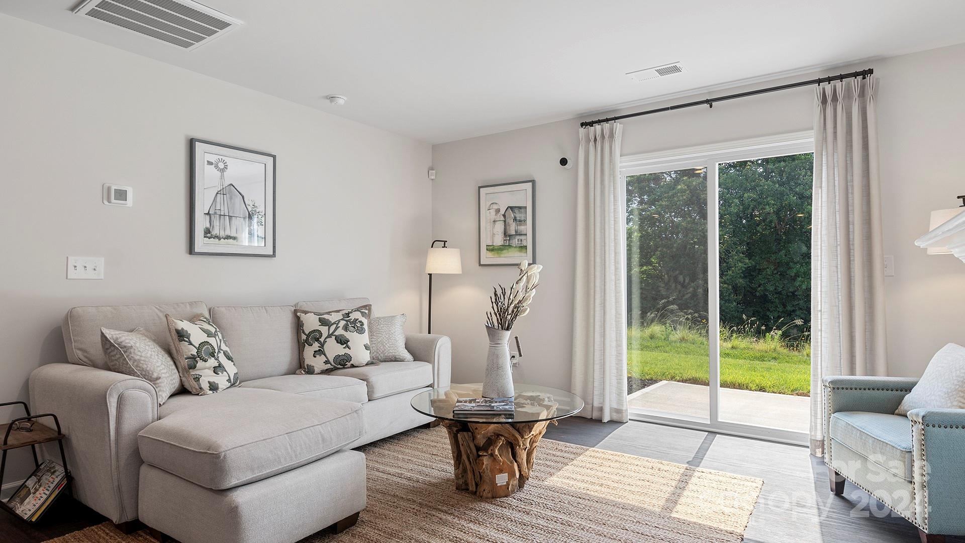 509 Jaca Lane Arden, NC 28704 - Photo 4 of 28 a living room with furniture and a large window
