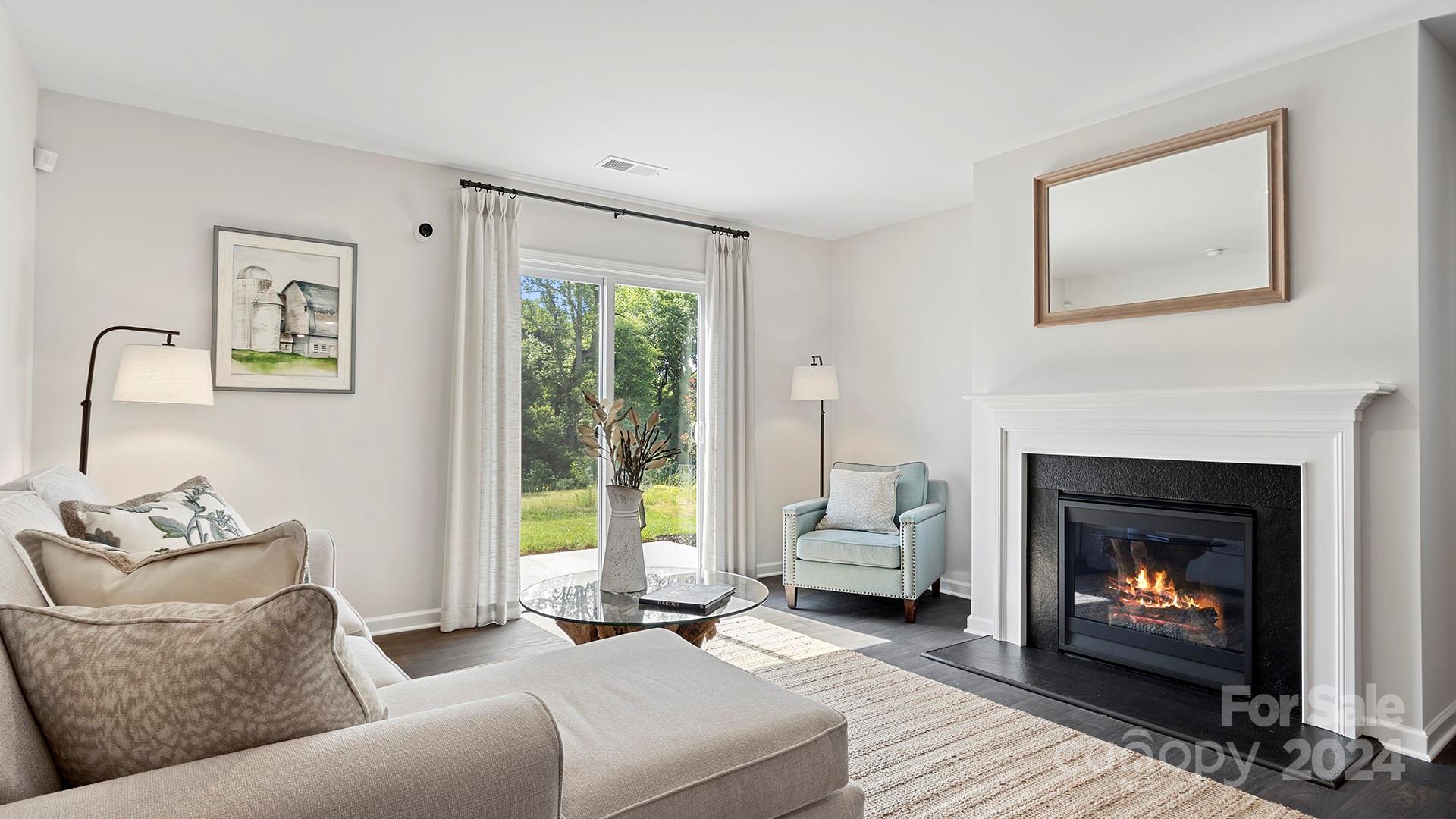 509 Jaca Lane Arden, NC 28704 - Photo 5 of 28 a living room with furniture and a fireplace