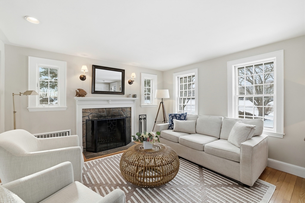 63 Bancroft Road Cohasset, MA 02025 - Photo 18 of 41 a living room with furniture a window and a fireplace