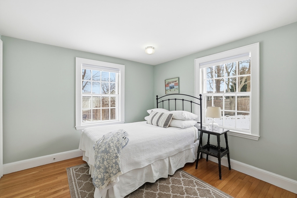63 Bancroft Road Cohasset, MA 02025 - Photo 19 of 41 a bedroom with a bed and a window