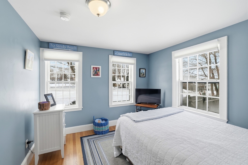 63 Bancroft Road Cohasset, MA 02025 - Photo 20 of 41 a bedroom with a bed and wooden floor