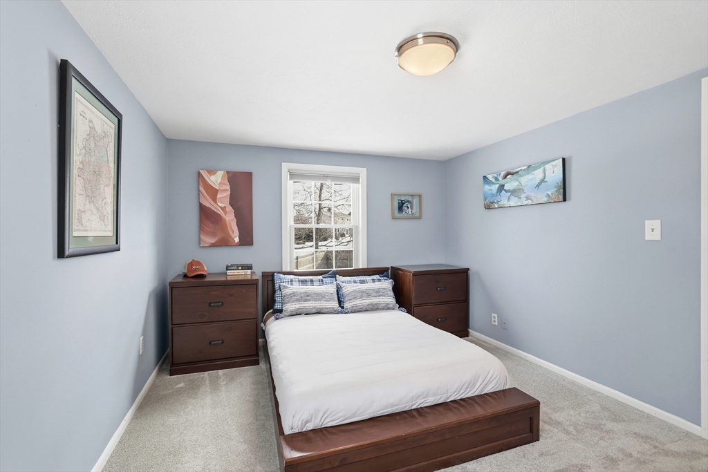 63 Bancroft Road Cohasset, MA 02025 - Photo 25 of 41 a bedroom with a bed and a window