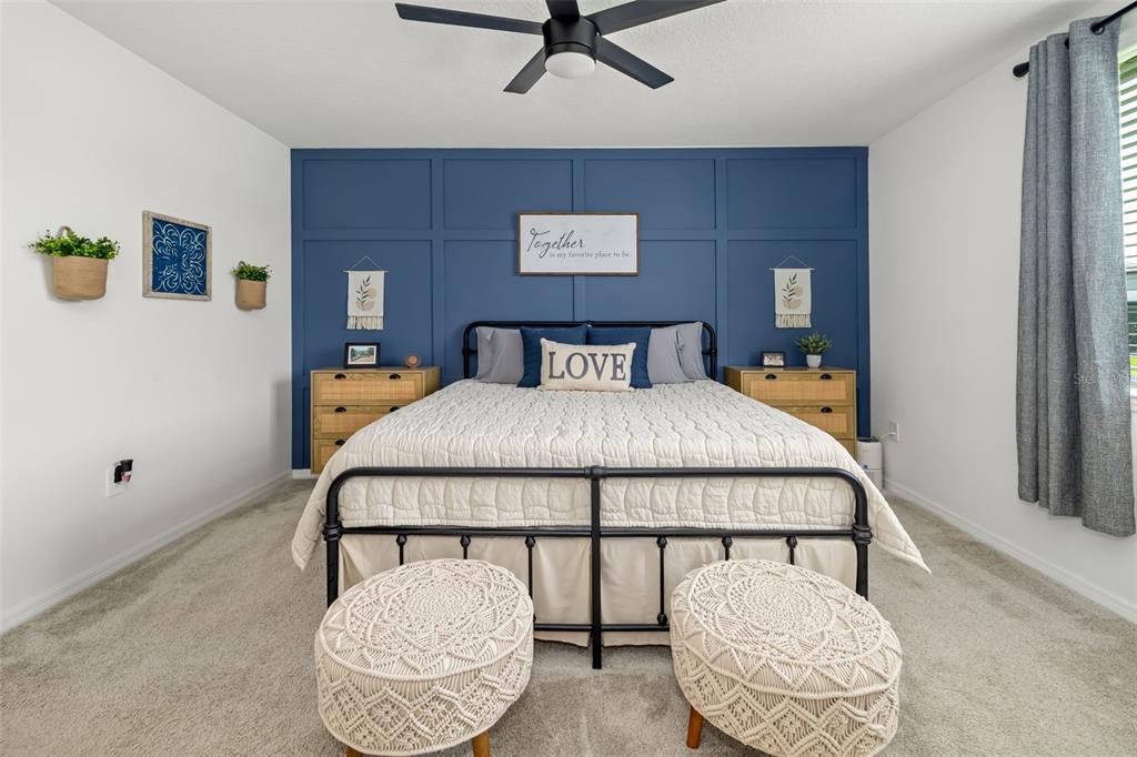 14086 Ginnie Spgs Way Parrish, FL 34219 - Photo 11 of 49 a bedroom with a bed and window