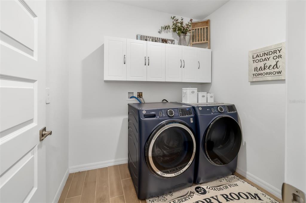 14086 Ginnie Spgs Way Parrish, FL 34219 - Photo 23 of 49 a view of a hallway with washer and dryer