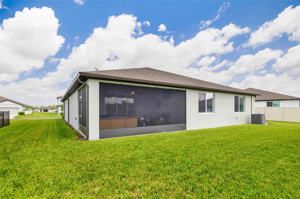 14086 Ginnie Spgs Way Parrish, FL 34219 - Photo 33 of 49 a house view with a garden space