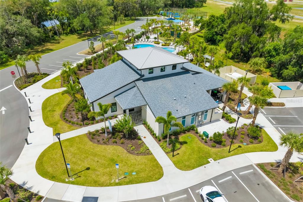 14086 Ginnie Spgs Way Parrish, FL 34219 - Photo 34 of 49 an aerial view of a house with swimming pool and large trees