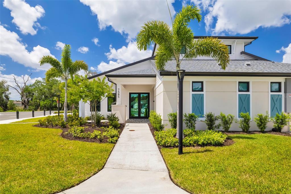 14086 Ginnie Spgs Way Parrish, FL 34219 - Photo 35 of 49 a view of a house with backyard porch and sitting area