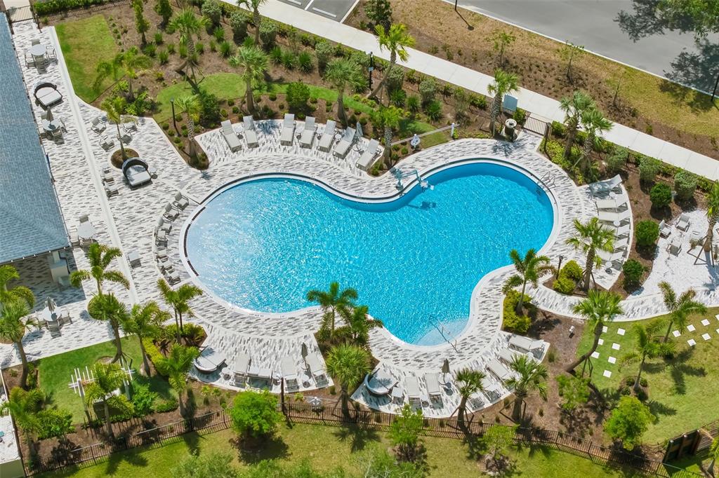 14086 Ginnie Spgs Way Parrish, FL 34219 - Photo 46 of 49 an aerial view of a house with swimming pool and outdoor seating