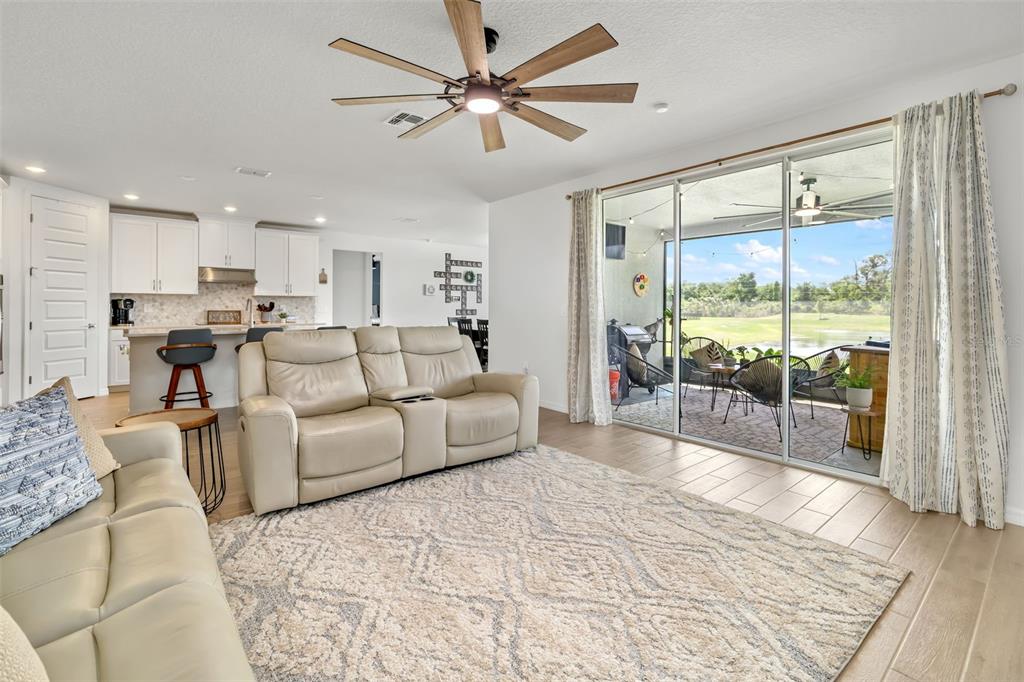 14086 Ginnie Spgs Way Parrish, FL 34219 - Photo 6 of 49 a living room with furniture and a large window