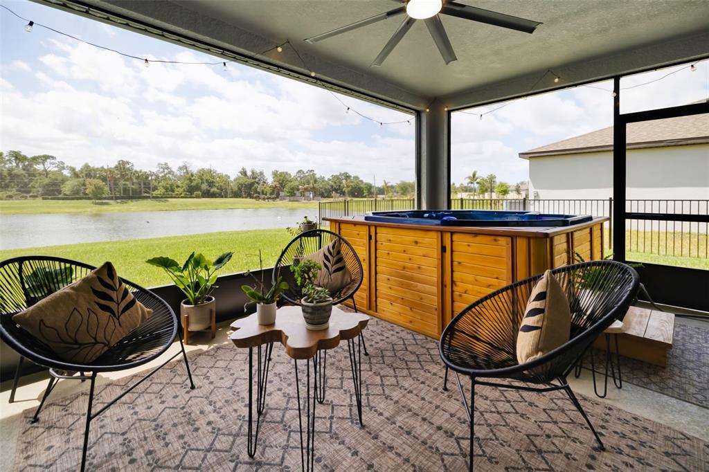14086 Ginnie Spgs Way Parrish, FL 34219 - Photo 9 of 49 a view of a balcony with furniture and outdoor seating