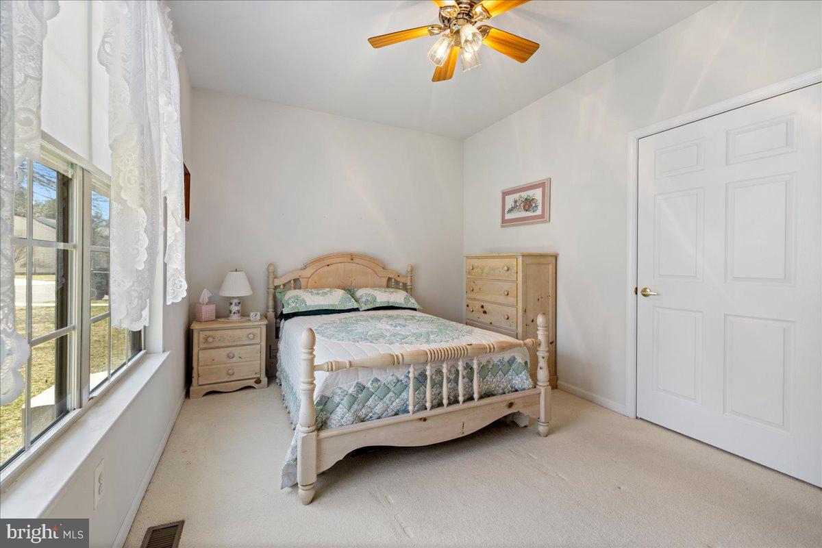 901 Nathaniel Trail Warminster, PA 18974 - Photo 15 of 30 a bedroom with a bed and a chandelier